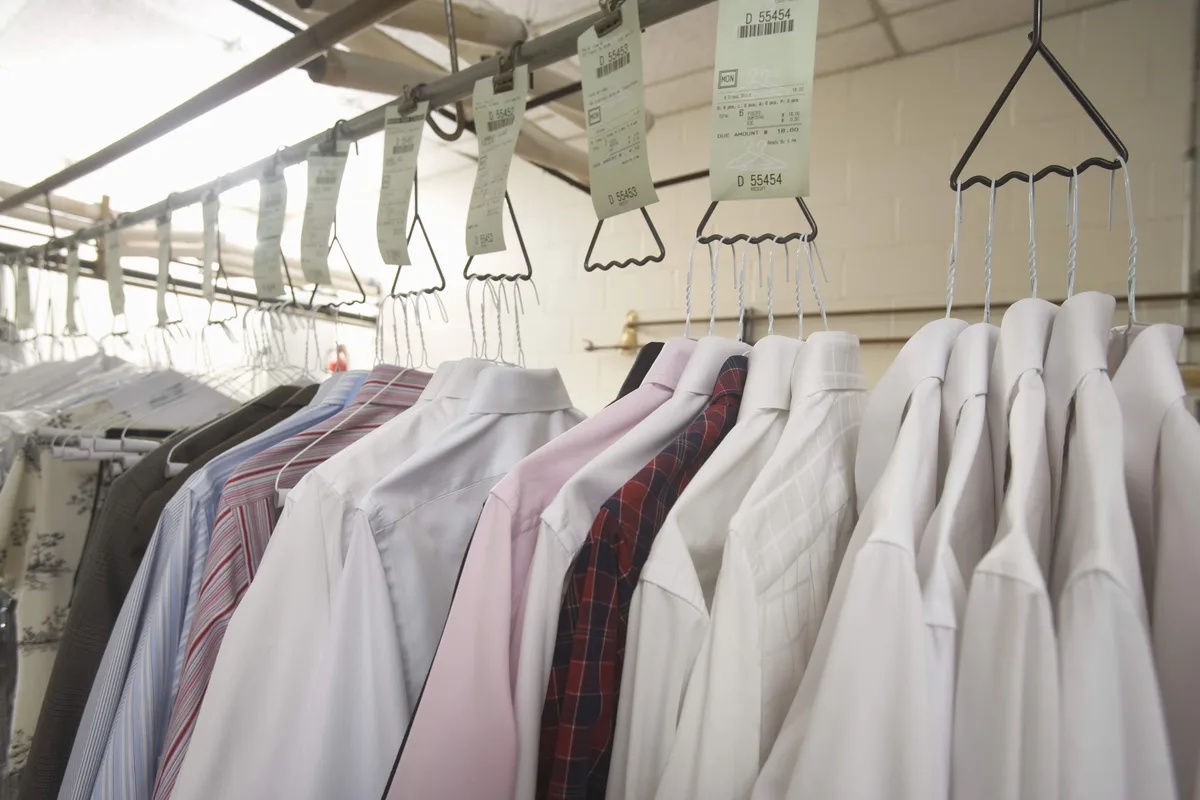 Freshly cleaned shirts hanging on the rack